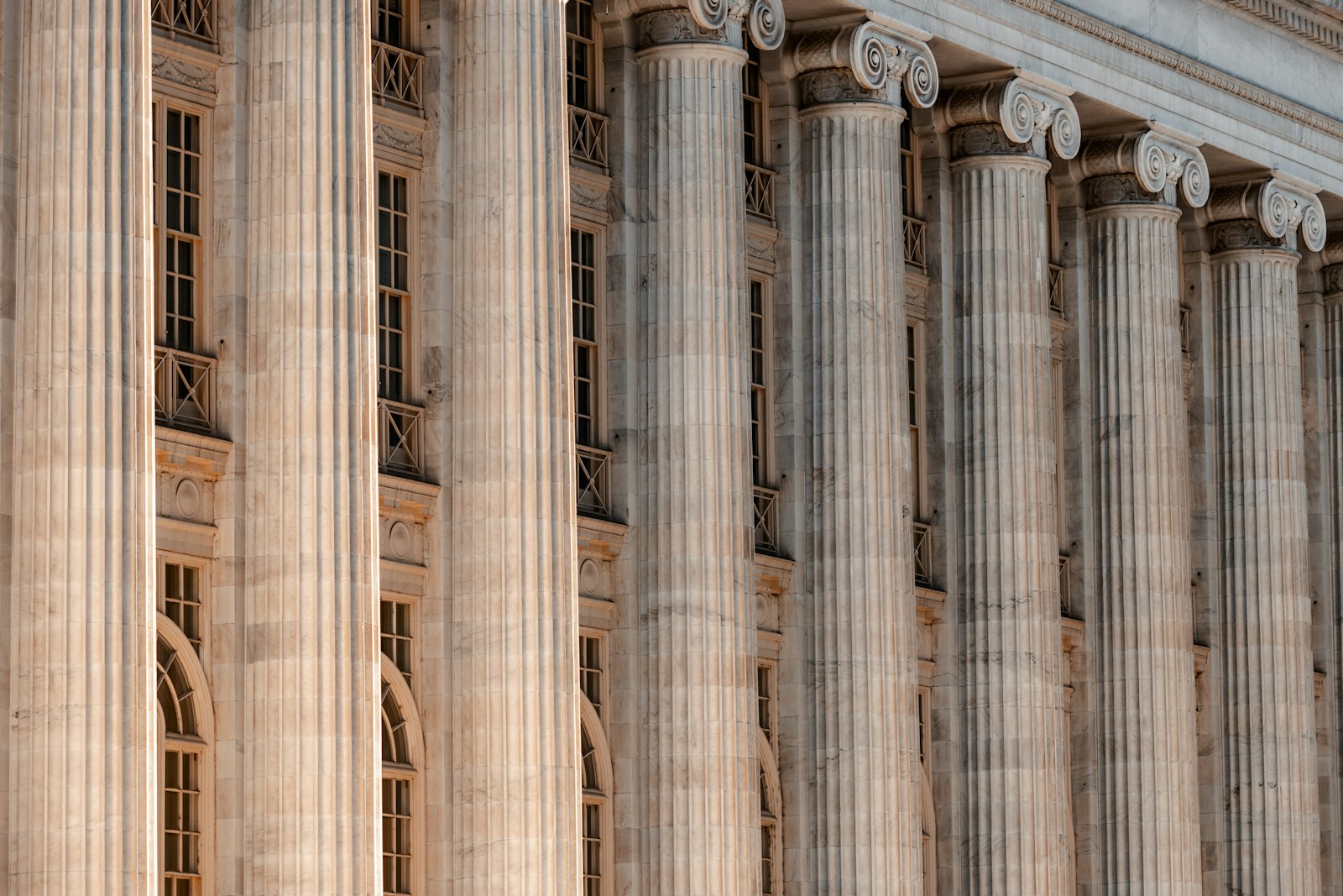 A close view of the stone columns on a courthouse building.