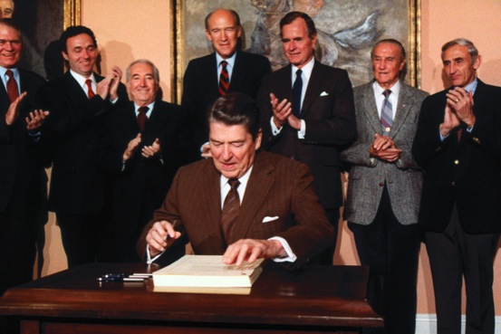 Ronald Reagan signs the Immigration and Control Act of 1986.